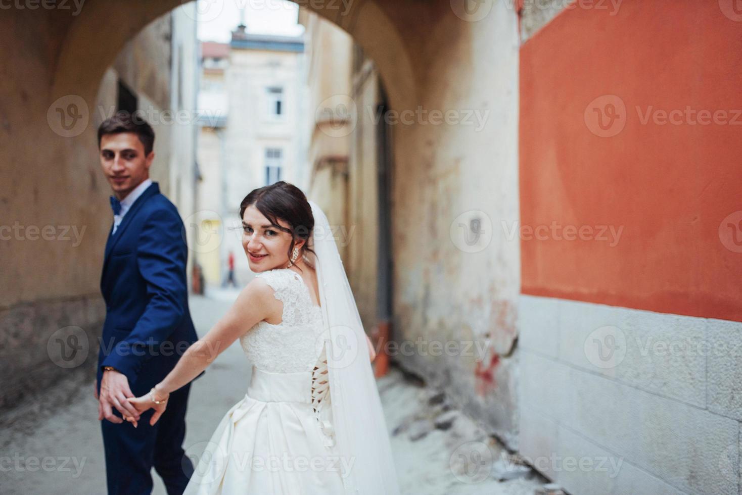 Wedding portrait of a happy couple. Stand and kissing photo