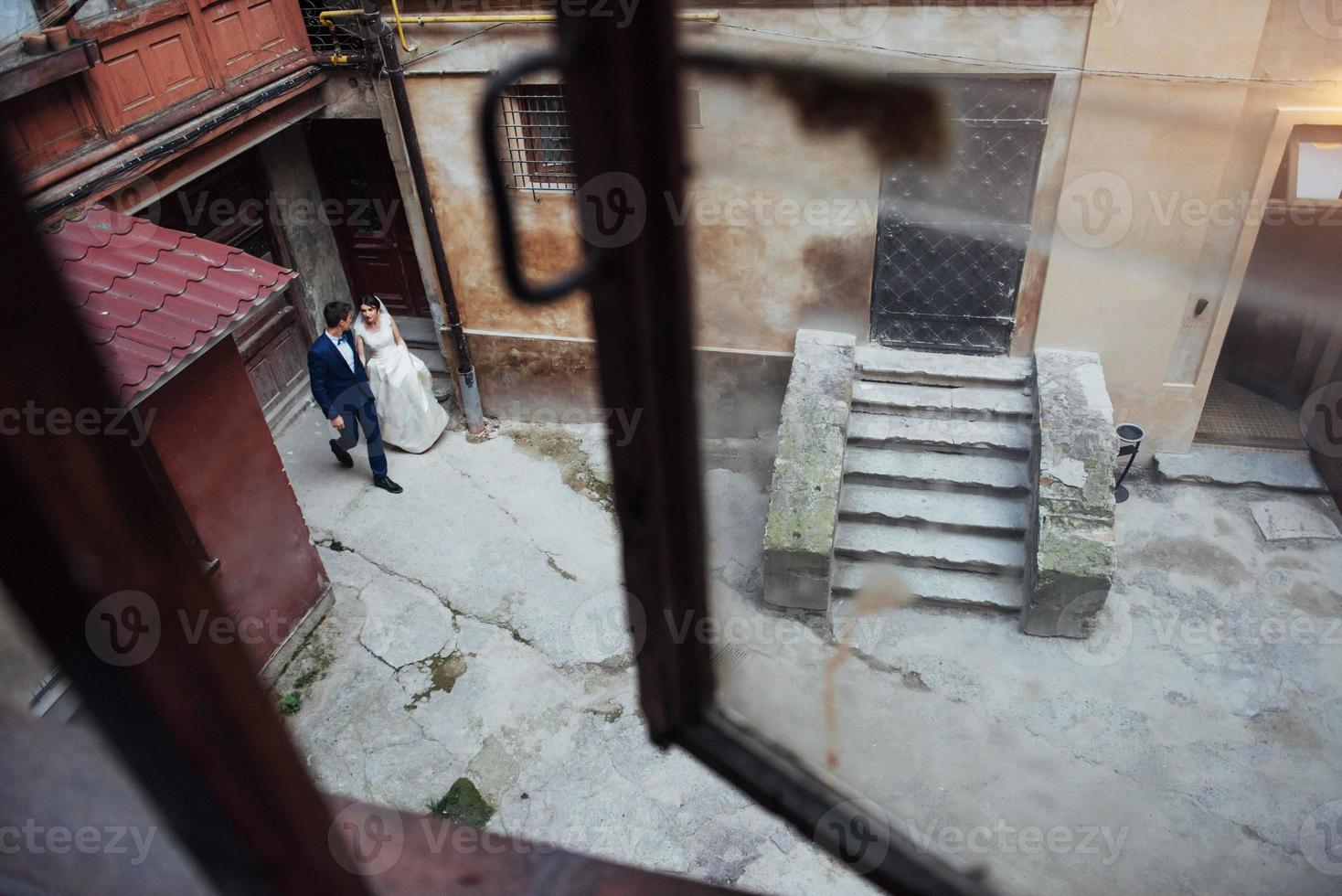 Wedding portrait of a happy couple. Stand and kissing photo