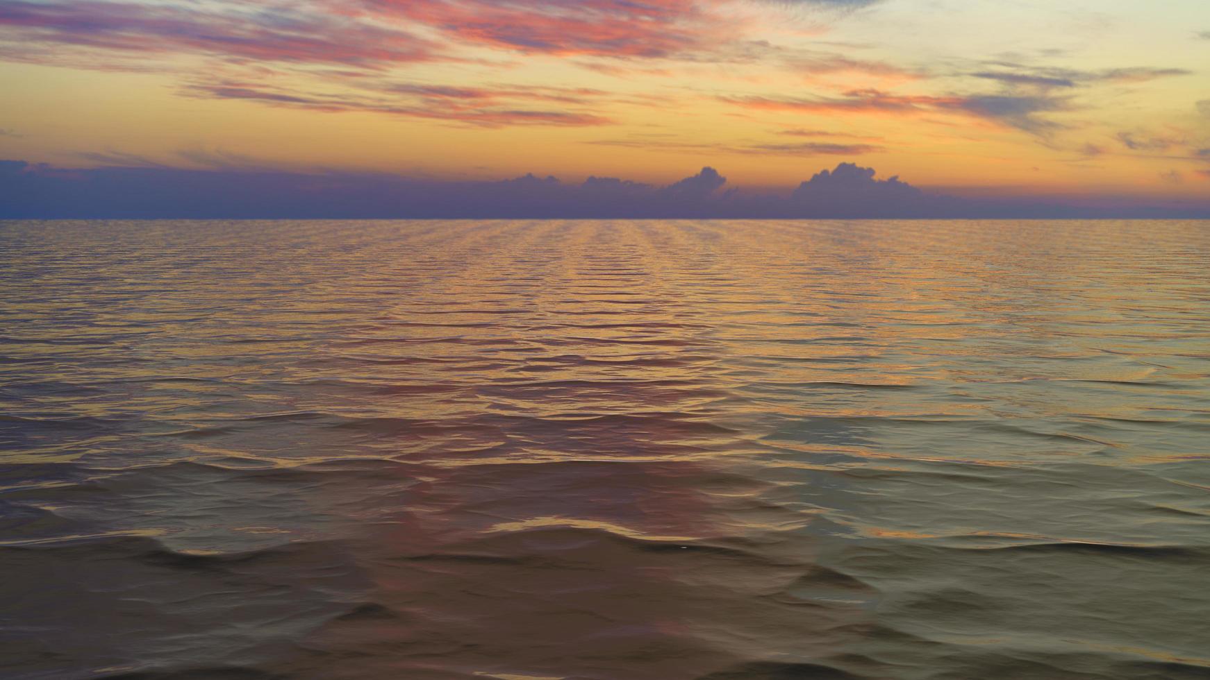 Seascape with a beautiful sunset over the water surface photo