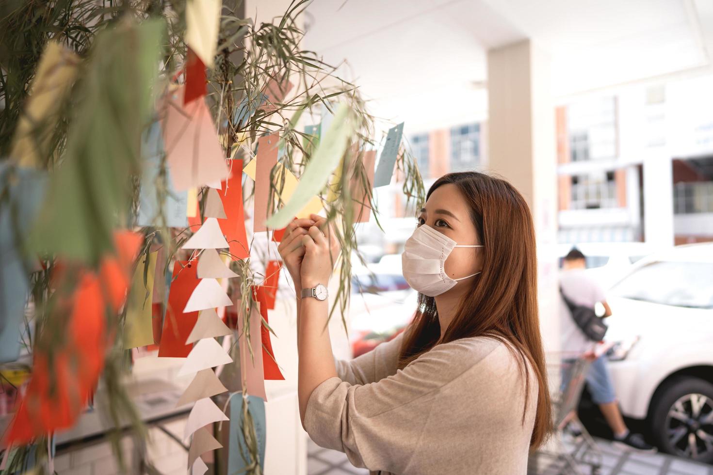 Tanabata japanese culture festival on july summer woman wear face mask protect covid-19 virus. photo