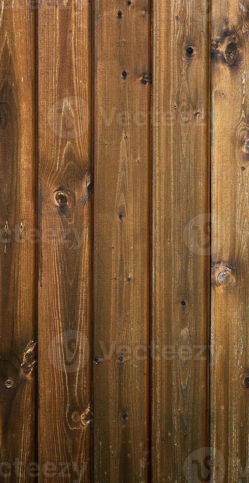 Flat lay dark textured wooden background made of brown boards. Old rustic horizontal boards. The concept is ecology, vintage, village, nature. Space for text. photo