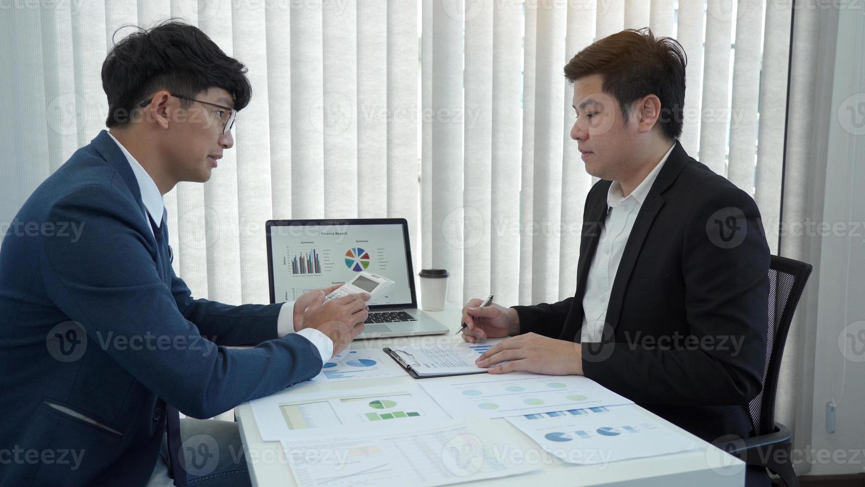 Teamwork with business people analysis cost graph on desk at meeting room. photo