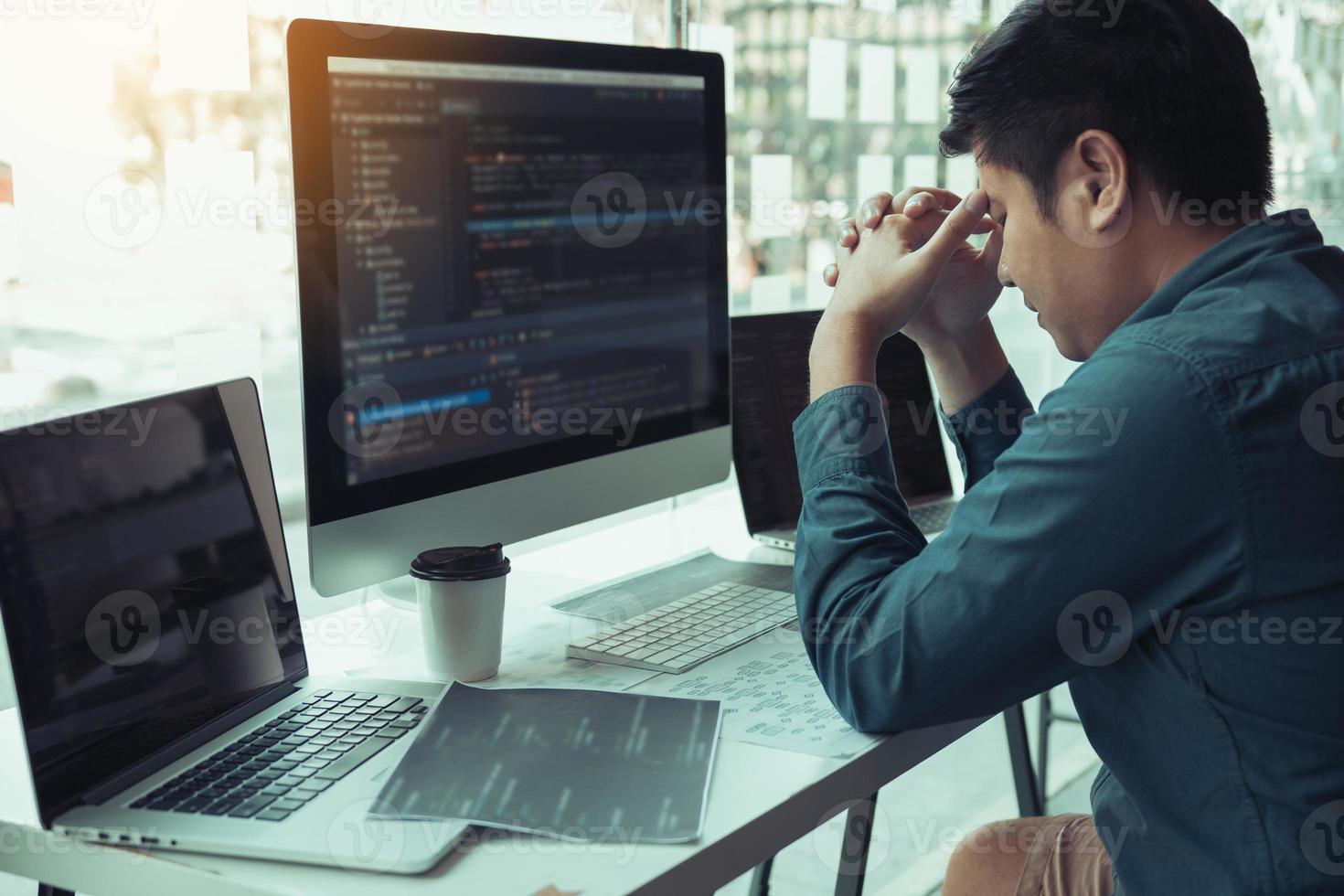 Software developers headache with code analysis in the office. photo