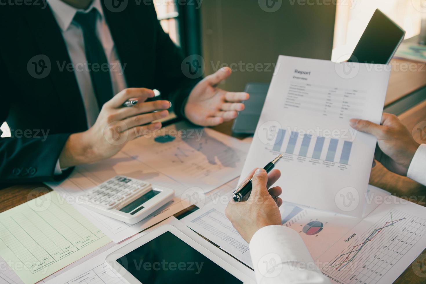 Group of business people analysis summary graph reports of business operating expenses and work data about the company's financial statements. photo