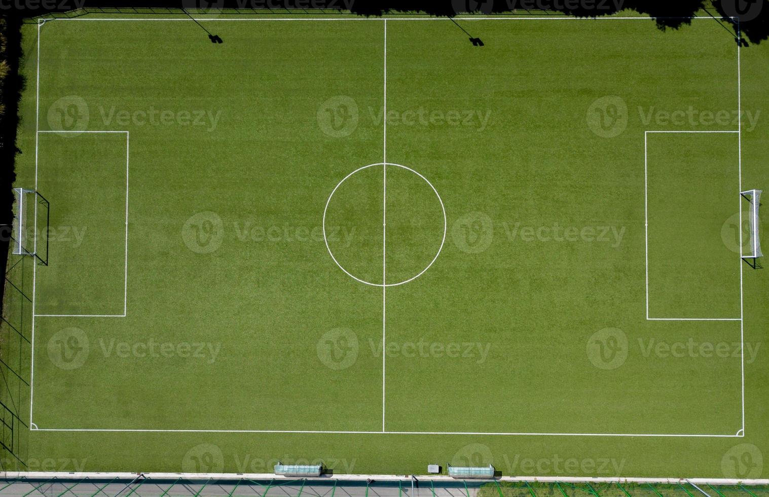 Football field with synthetic grass photo