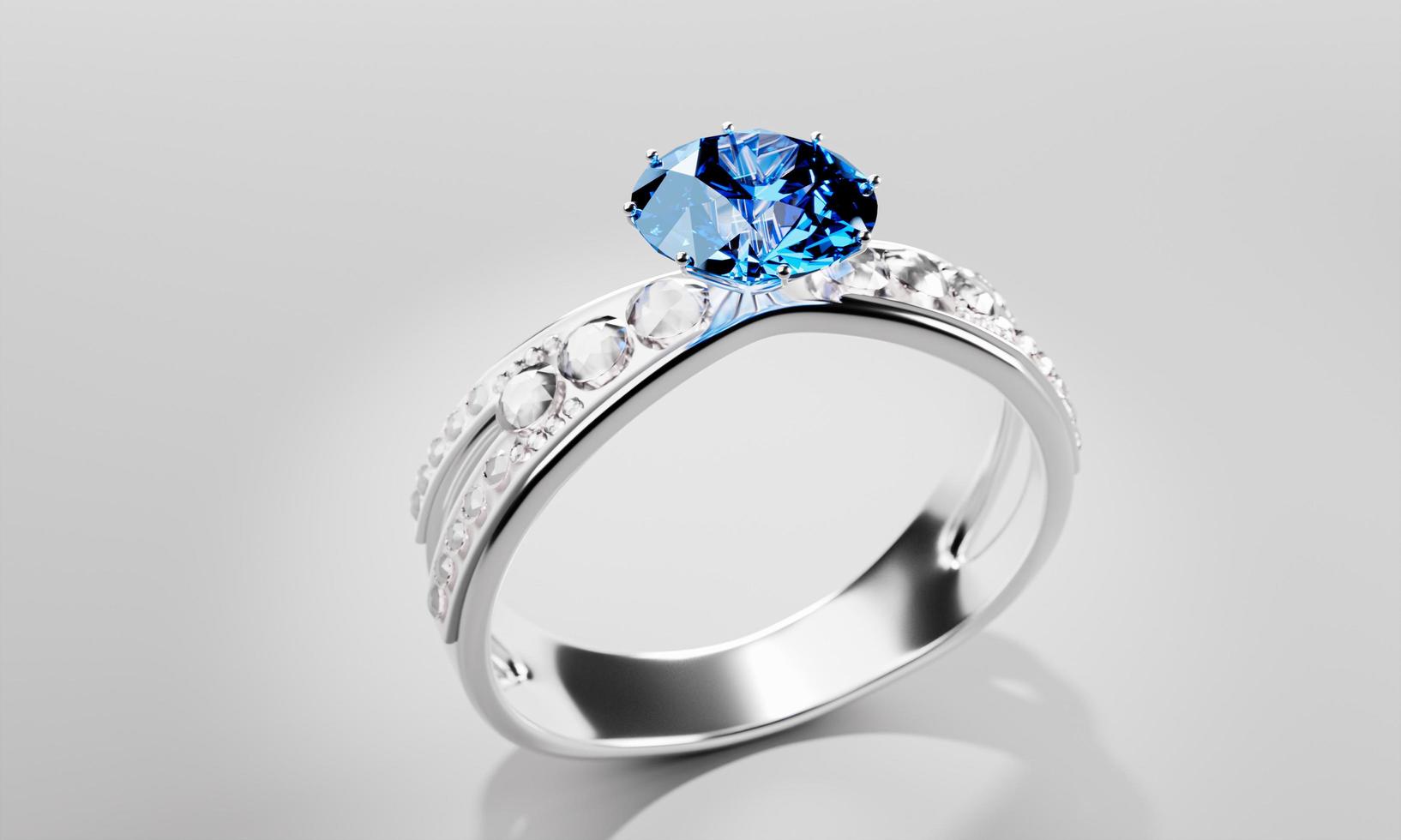 The large blue diamond is surrounded by many diamonds on the ring made of platinum gold placed on a gray background. Elegant wedding diamond ring for women.  3d rendering photo