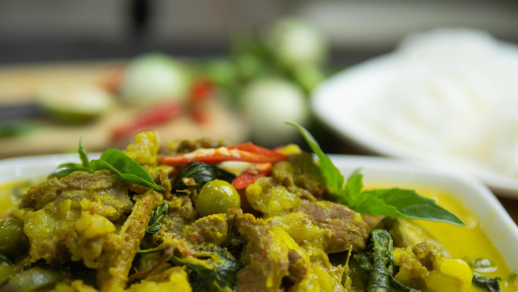Green curry with beef. Famous food in Thailand. The food consists of curry paste. Blended with herbs Simmered with coconut milk And meat Season with fish sauce and sugar,add brinjal and sweet eggplant photo