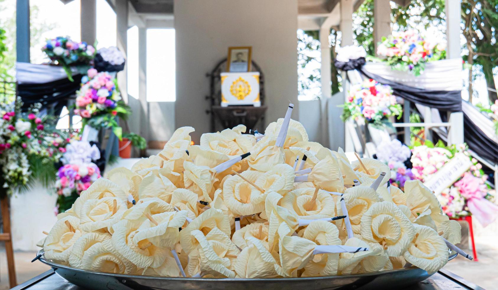 Sandalwood flowers are made from sap or corn husks. Used in funeral ceremonies in Buddhist traditions in Thailand. Artificial flowers for funeral use. most Thai people. Circle bouquet called wreath. photo