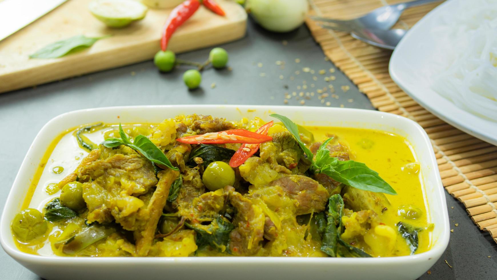 Green curry with beef. Famous food in Thailand. The food consists of curry paste. Blended with herbs Simmered with coconut milk And meat Season with fish sauce and sugar,add brinjal and sweet eggplant photo