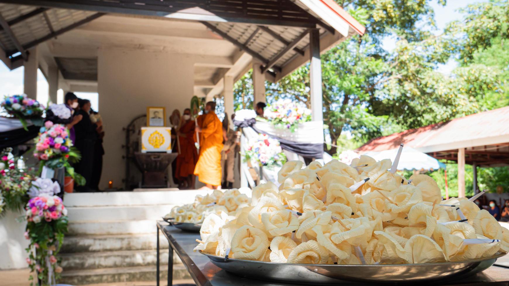 Sandalwood flowers are made from sap or corn husks. Used in funeral ceremonies in Buddhist traditions in Thailand. Artificial flowers for funeral use. most Thai people. Circle bouquet called wreath. photo