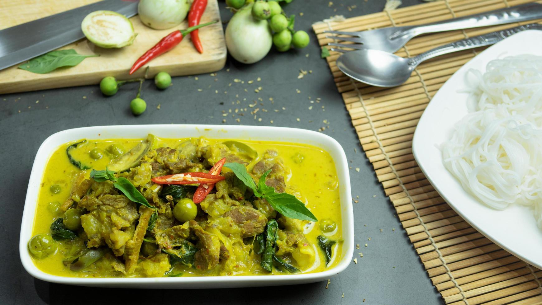Green curry with beef. Famous food in Thailand. The food consists of curry paste. Blended with herbs Simmered with coconut milk And meat Season with fish sauce and sugar,add brinjal and sweet eggplant photo