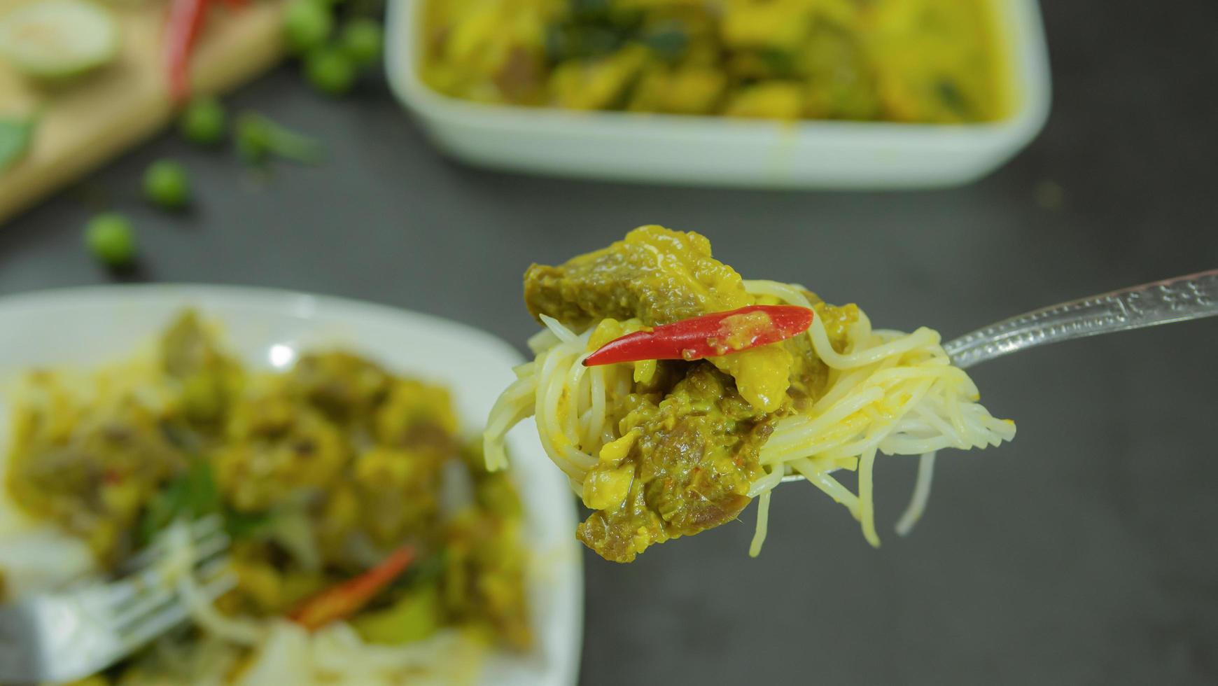 Green curry with beef. Famous food in Thailand. The food consists of curry paste. Blended with herbs Simmered with coconut milk And meat Season with fish sauce and sugar,add brinjal and sweet eggplant photo