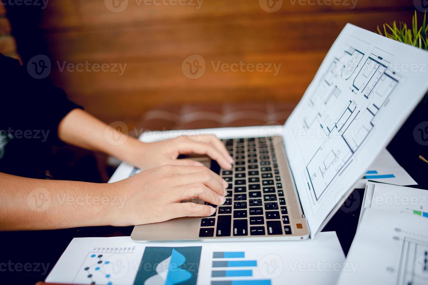 Businessman working at a computer office And graphs on his desk. Business concept And copy space photo