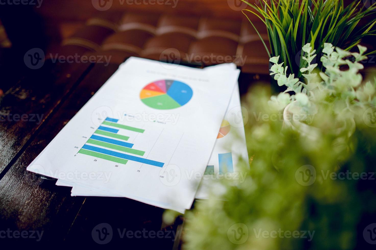 Office space And graphs on his desk. Business ideas and space for copy. photo