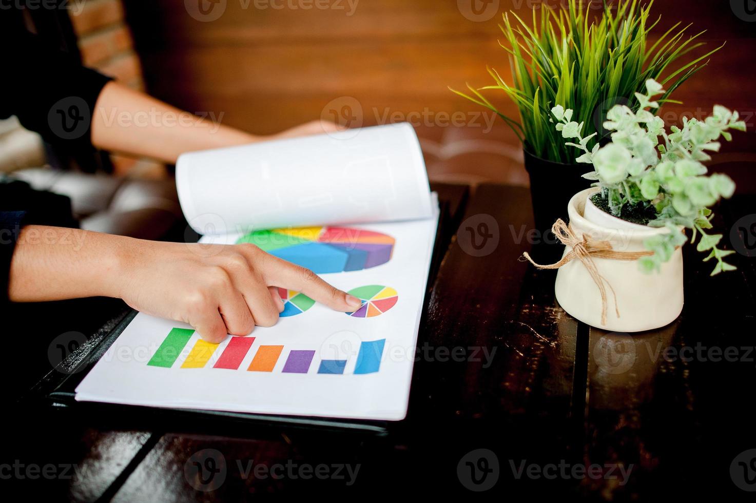 Businessman working at a computer office And graphs on his desk. Business ideas and space for copy. photo