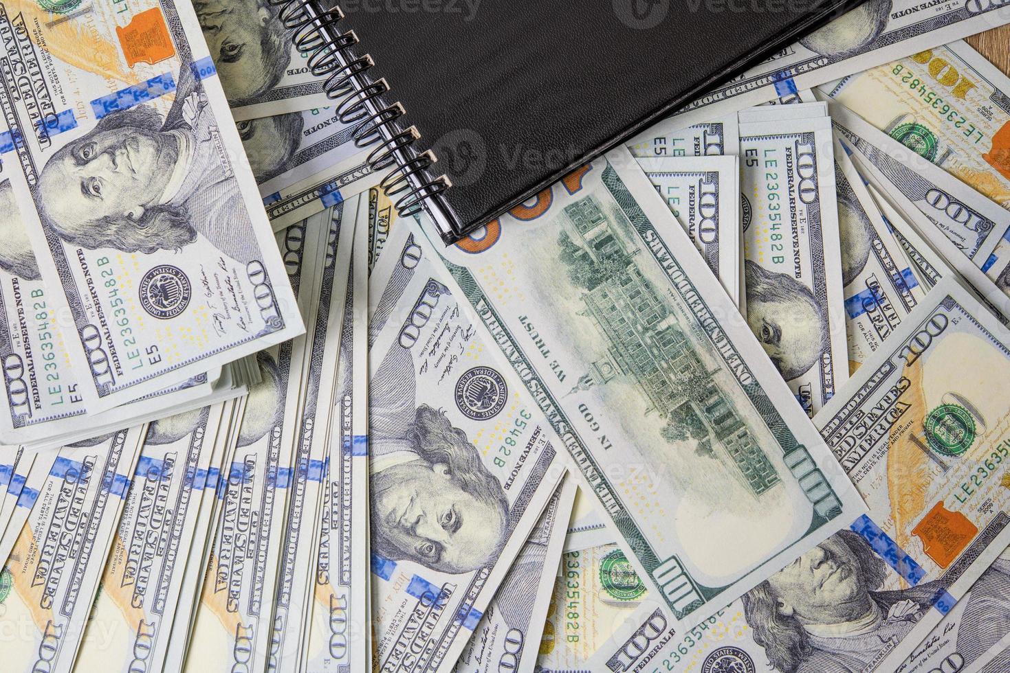 Business Diagrams on Financial Reports, Dollars and Business Diagrams on Coin Financial Reports and Notebooks. Work and profit photo