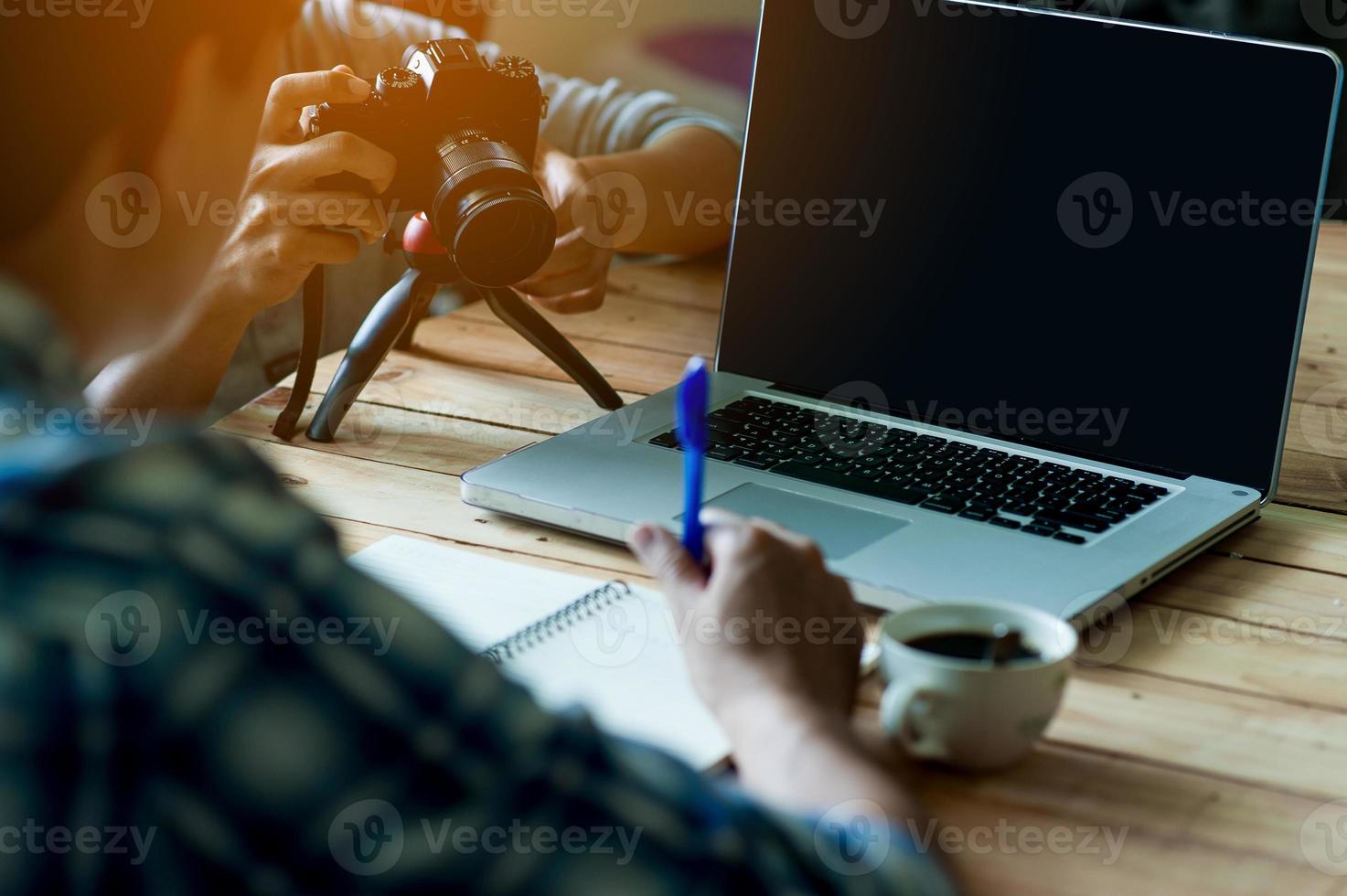 Writing on paper at work on the table in the morning, business ideas. There is space for copying. photo