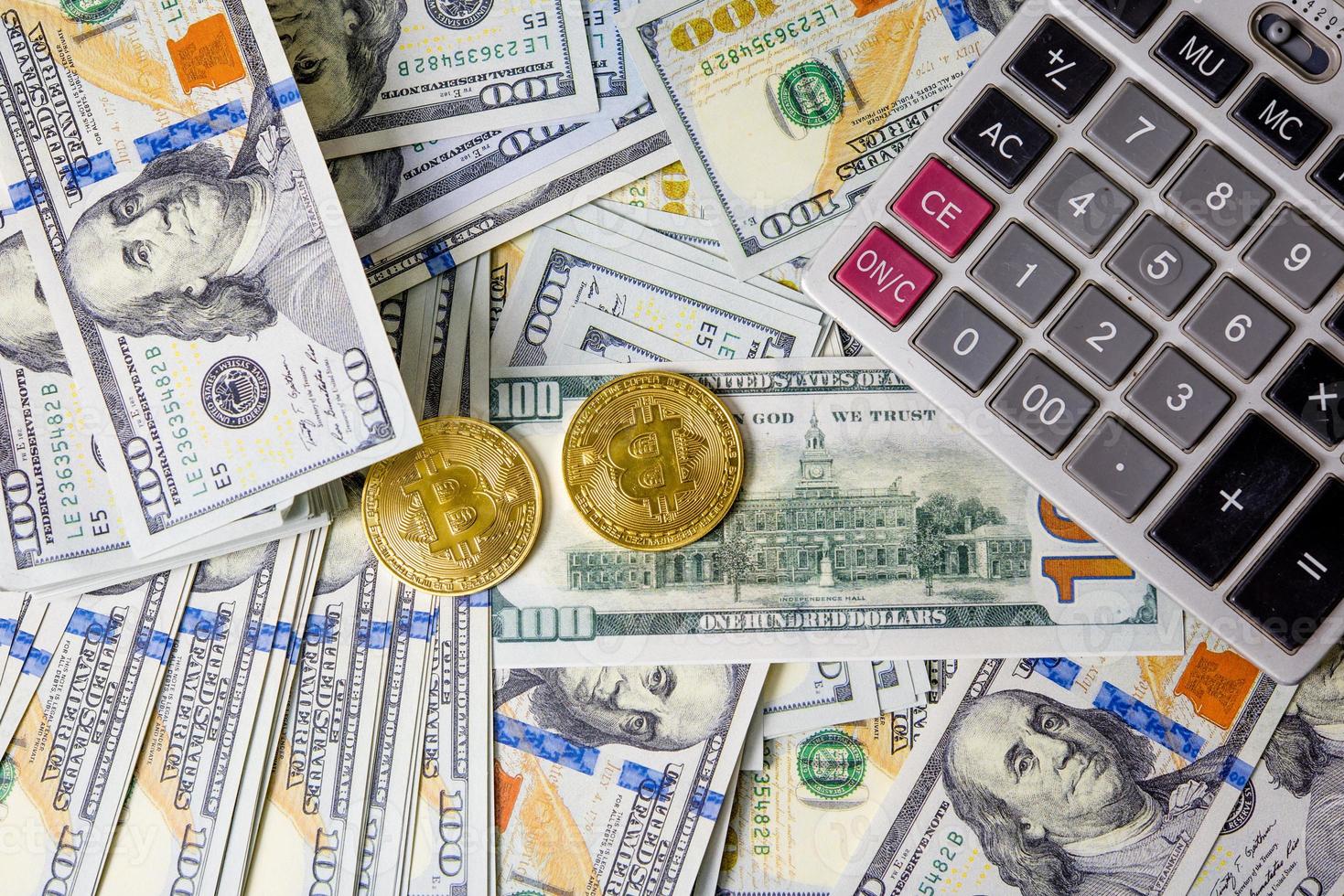 Business Graphs on Coin and Dollar Financial Reports and Calculators Business Diagrams on Coin Financial Reports and Calculators Work and profit... photo