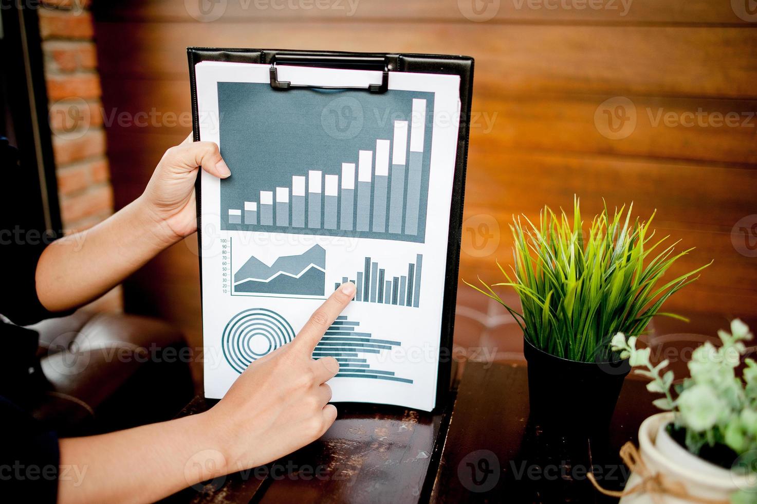 Businessman working at a computer office And graphs on his desk. Business ideas and space for copy. photo