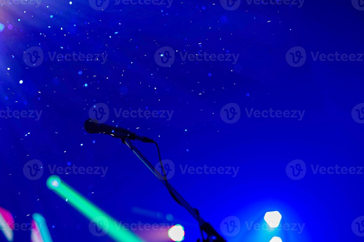 Show on stage with microphone on with bright background in celebration concept with copy space.... photo