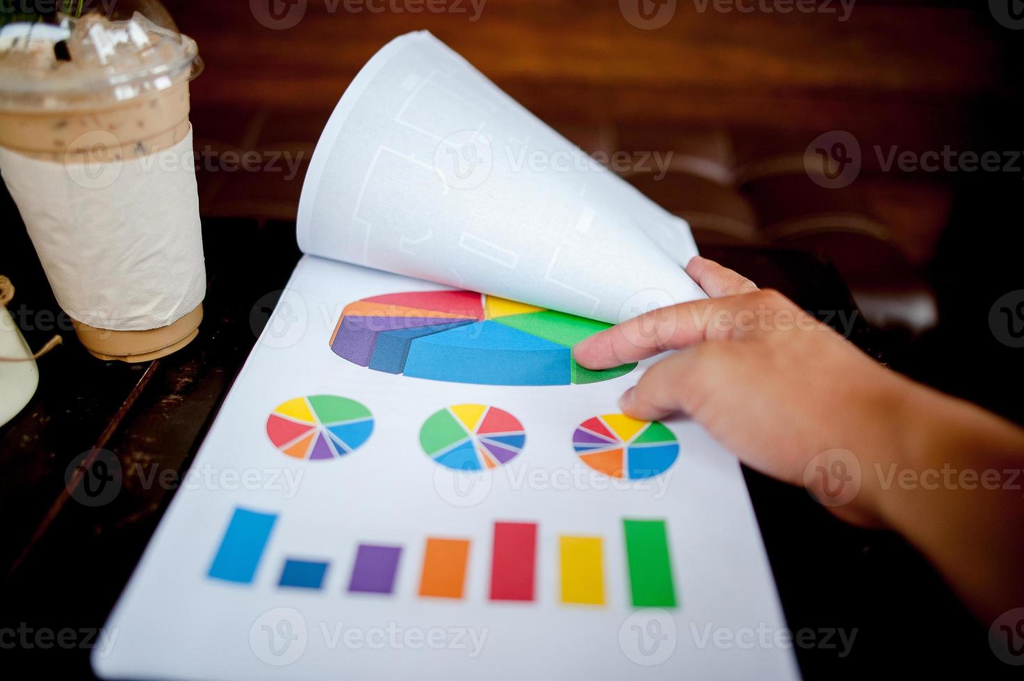 Businessman working at the office And graphs on his desk. Business concept And copy space photo