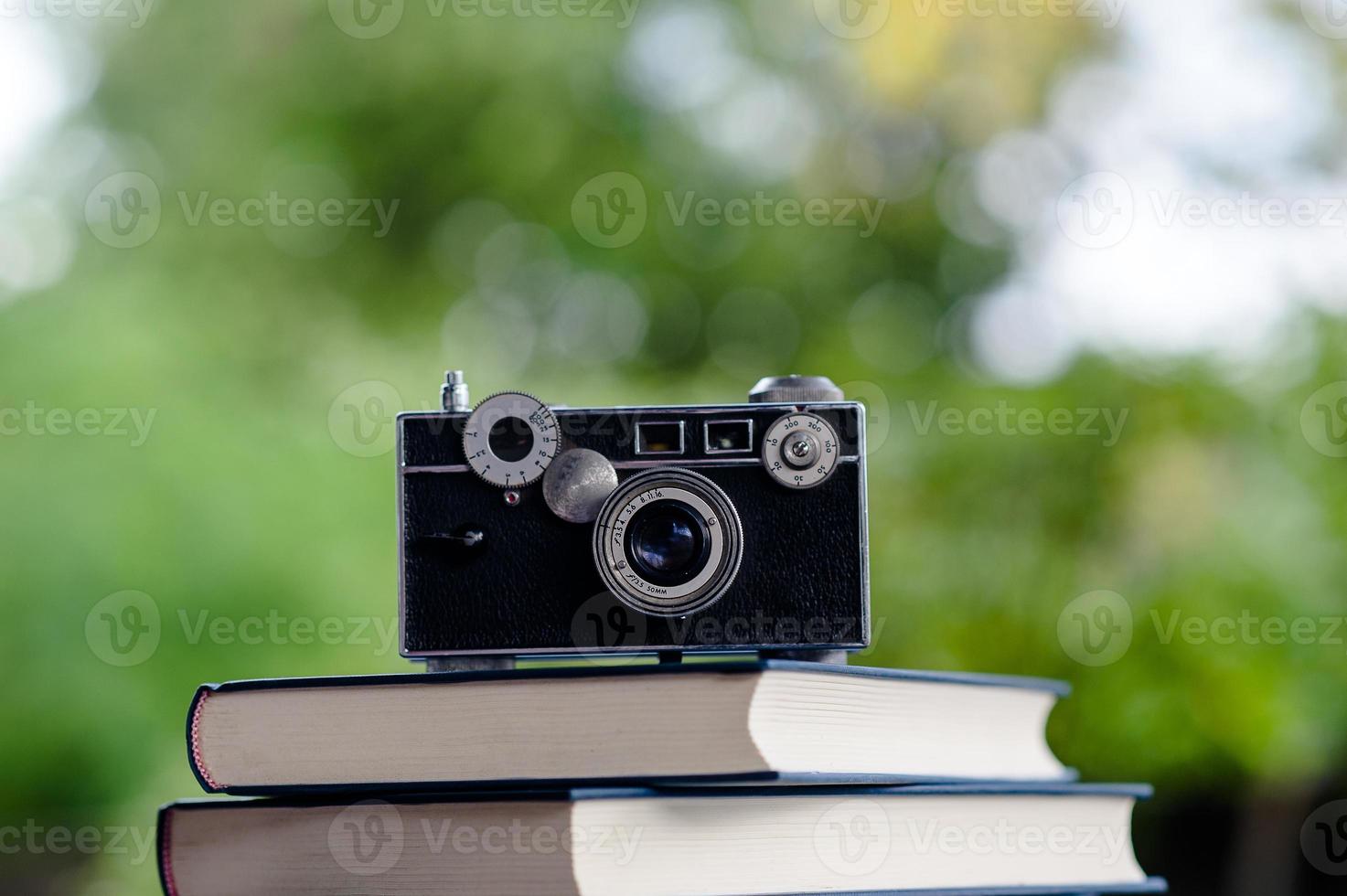 Books and Cameras Put on the floor. White leather Book and study The concept of empathy and development photo