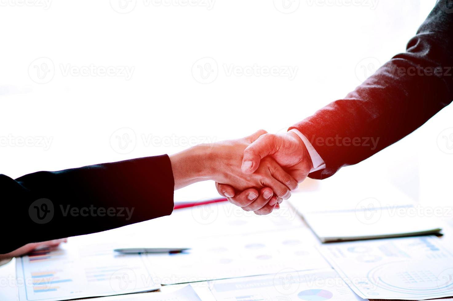 Businessmen shake hands Teamwork, teamwork, understanding, work To succeed On the job photo