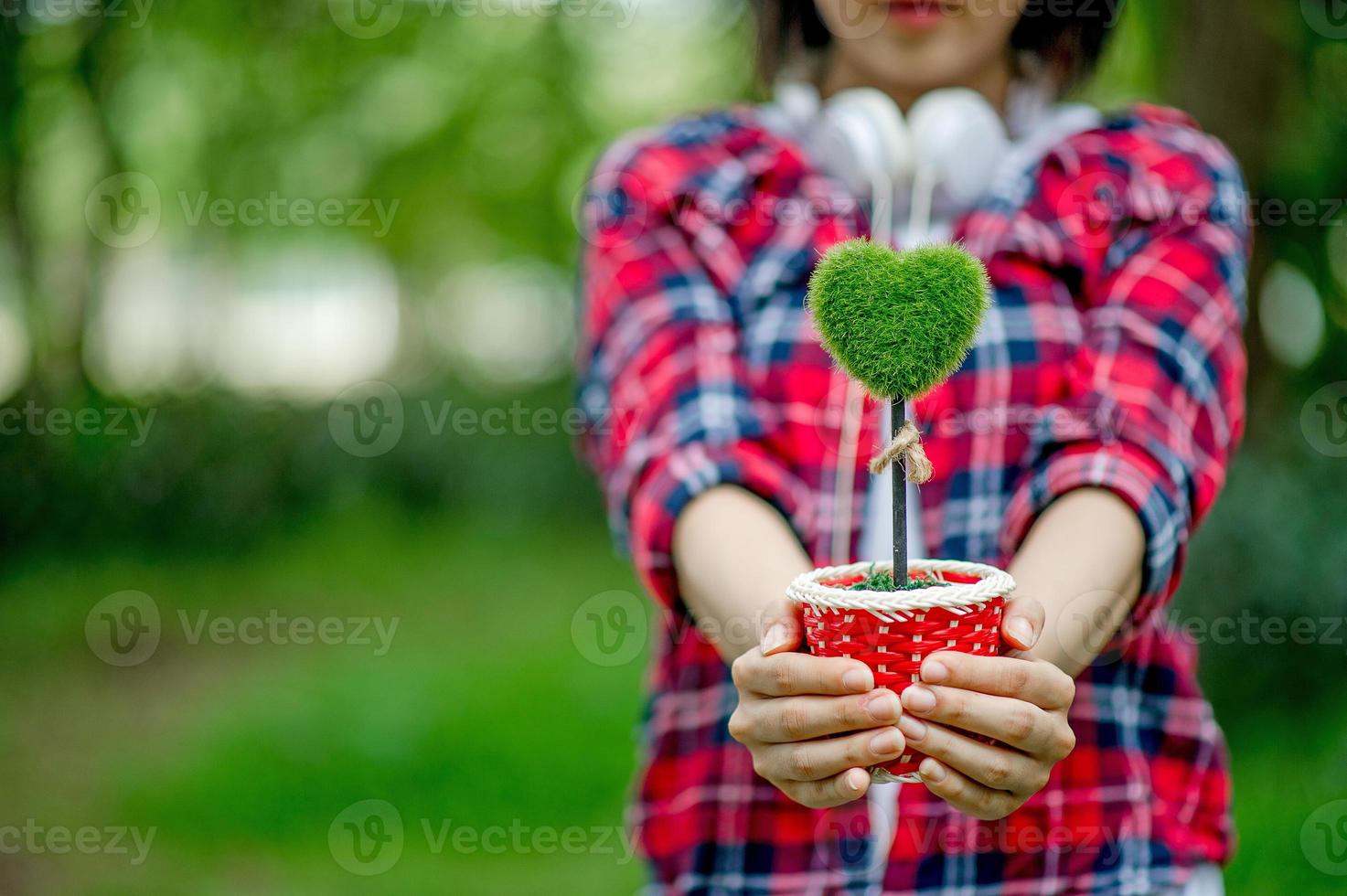 Hands and hearts, hands and heart-shaped flower pots, and with copy space. photo