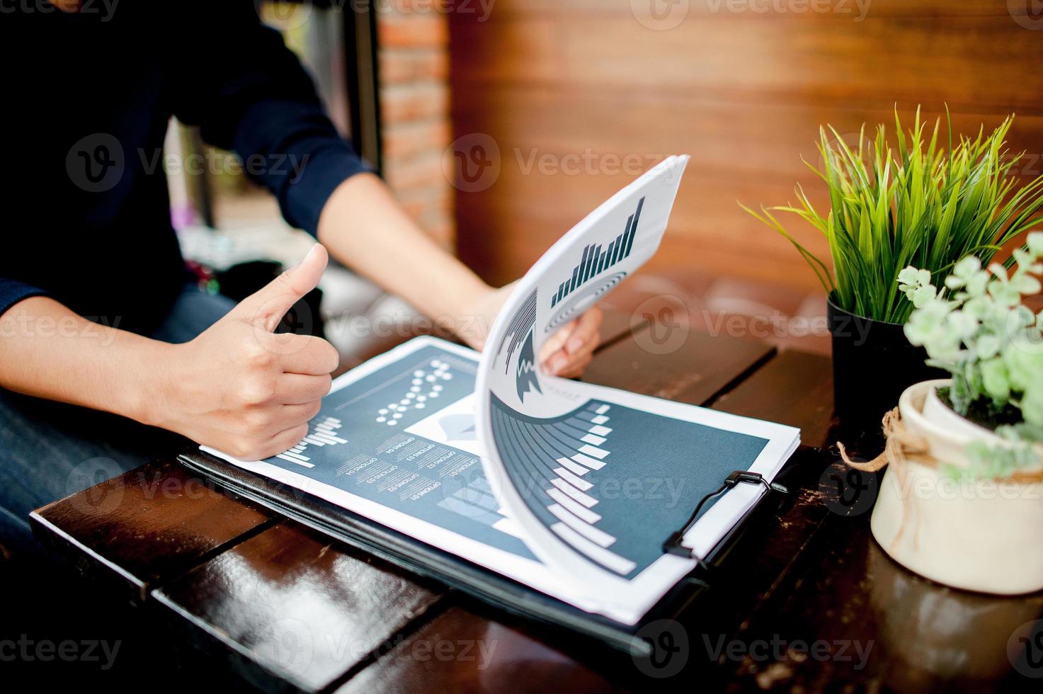 Work Desk Home Hand of the Worker Graph Paper Business Success With copy space photo