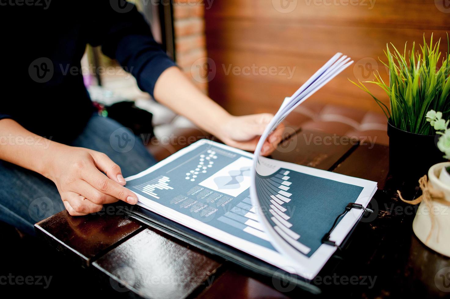 Businessman working at a computer office And graphs on his desk. Business ideas and space for copy. photo