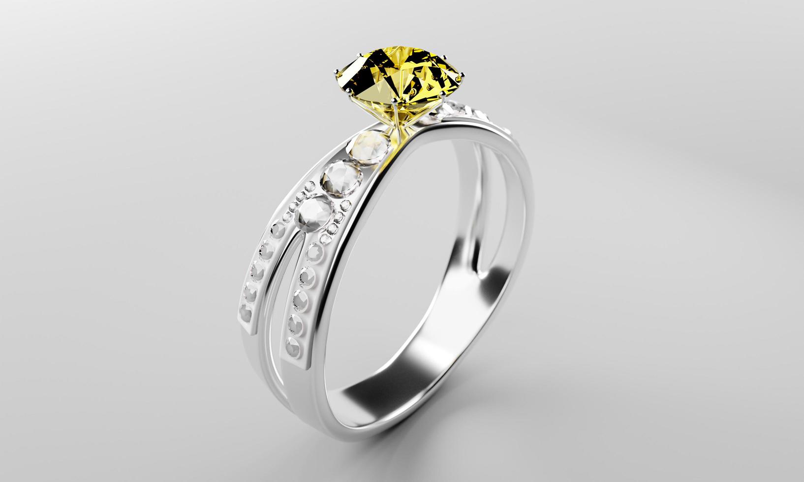el gran diamante amarillo está rodeado de muchos diamantes en el anillo de oro platino colocado sobre un fondo gris. Elegante anillo de bodas con diamantes para mujer. representación 3d foto
