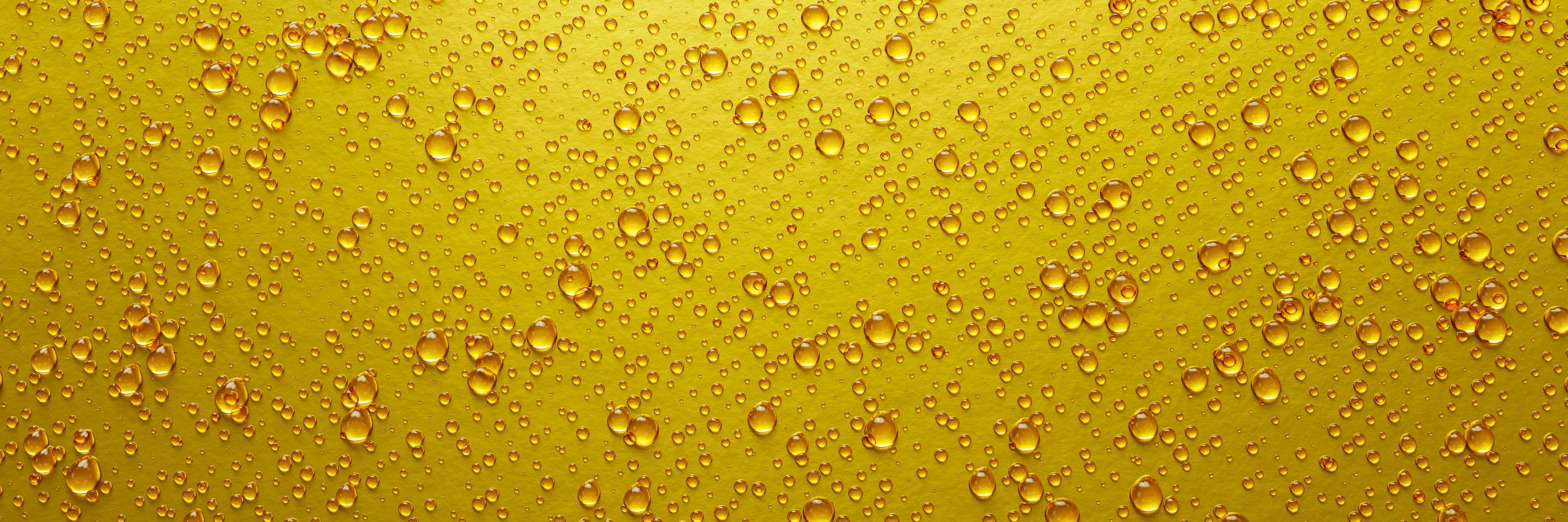 A lot of water droplets On metal or metallic surfaces in yellow and gold shades for mobile smartphone background or wallpaper. 3D Rendering. photo