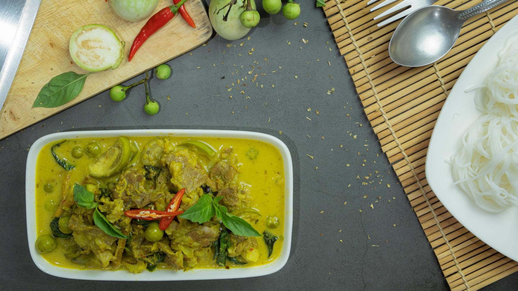 Green curry with beef. Famous food in Thailand. The food consists of curry paste. Blended with herbs Simmered with coconut milk And meat Season with fish sauce and sugar,add brinjal and sweet eggplant photo
