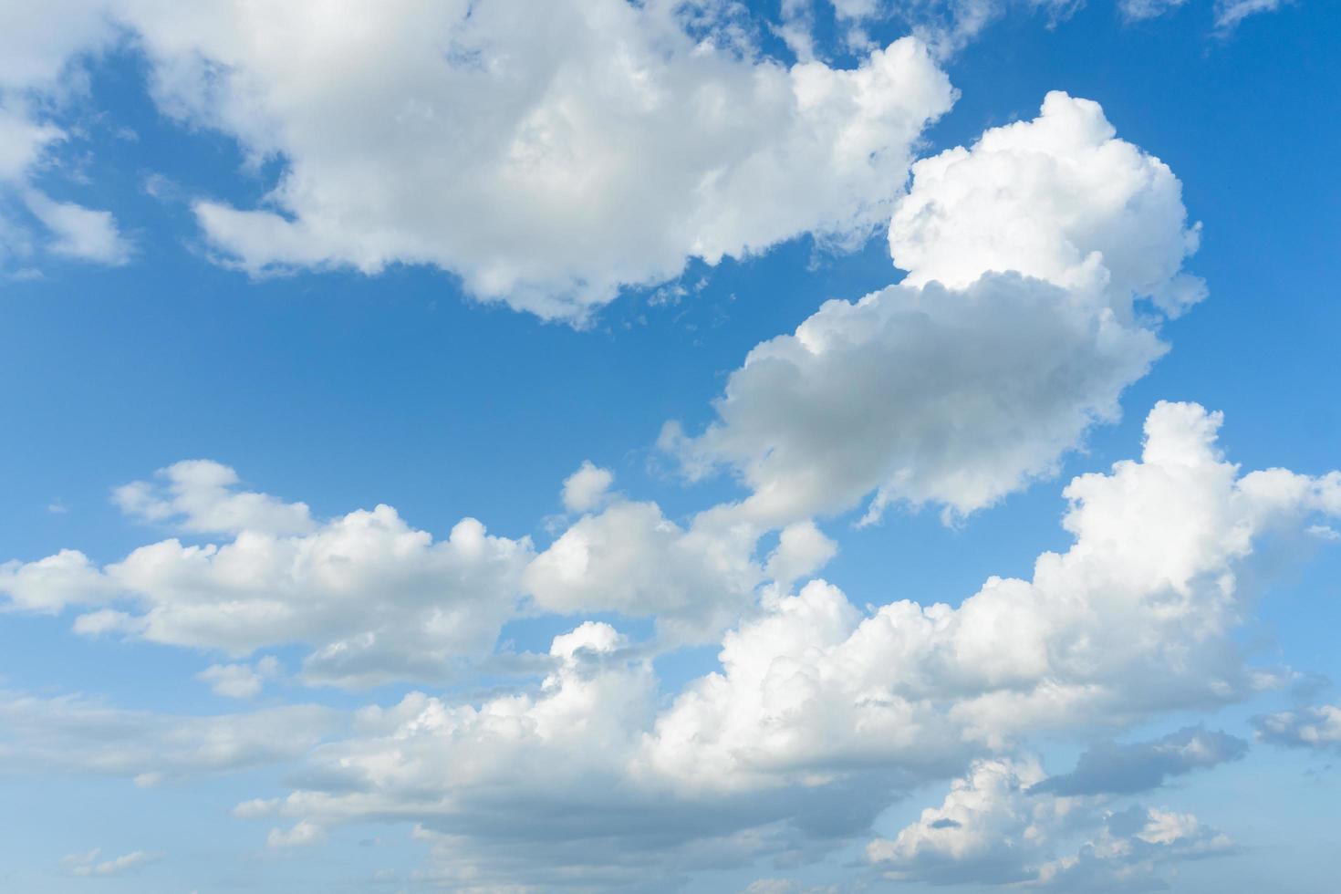 Cirrus and cumulus clouds on blue sky background. photo