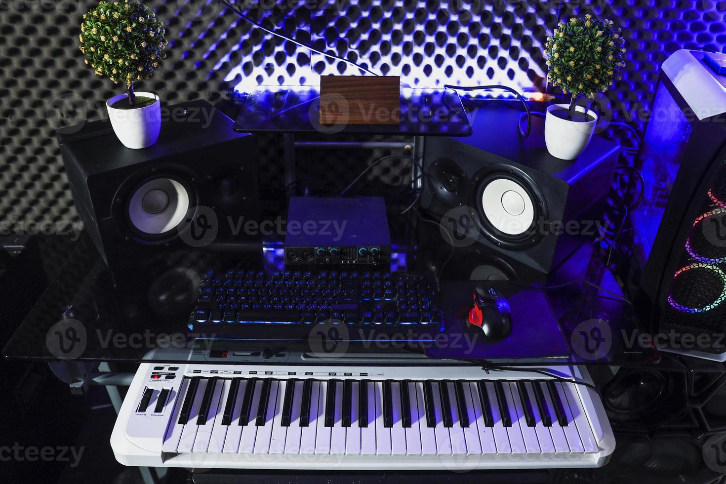 Recording studio with keyboard, speaker and electric piano photo