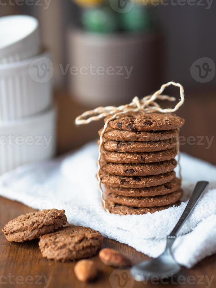 A stack organic oatmeal cookies tied with rope. photo