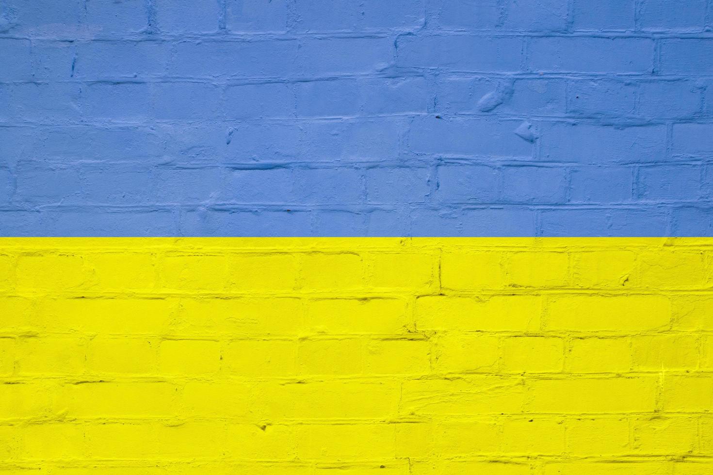 Brick texture in the colors of the yellow-blue flag of ukraine. Ukrainian symbolism concept photo