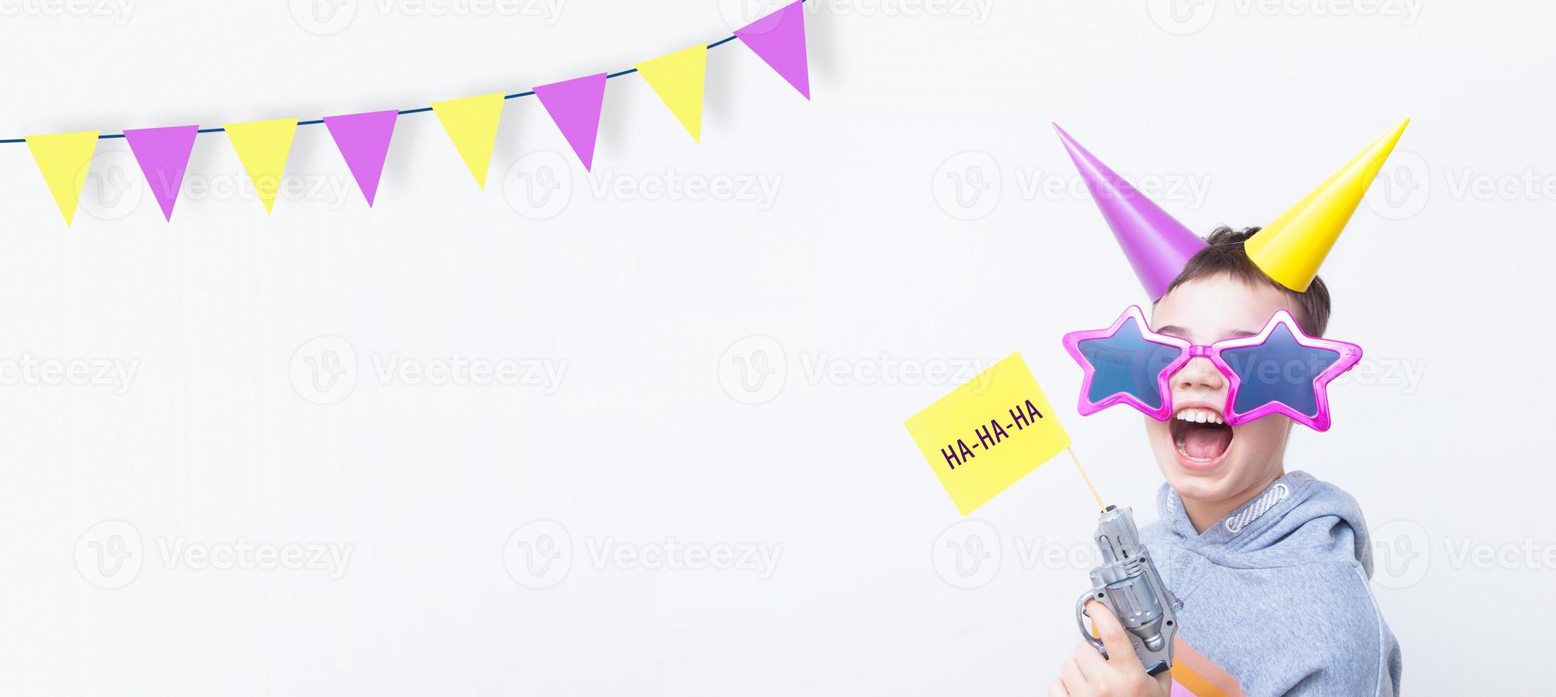Banner with cheerful boy for the April Fool's day. April 1st celebration concept with copy space photo