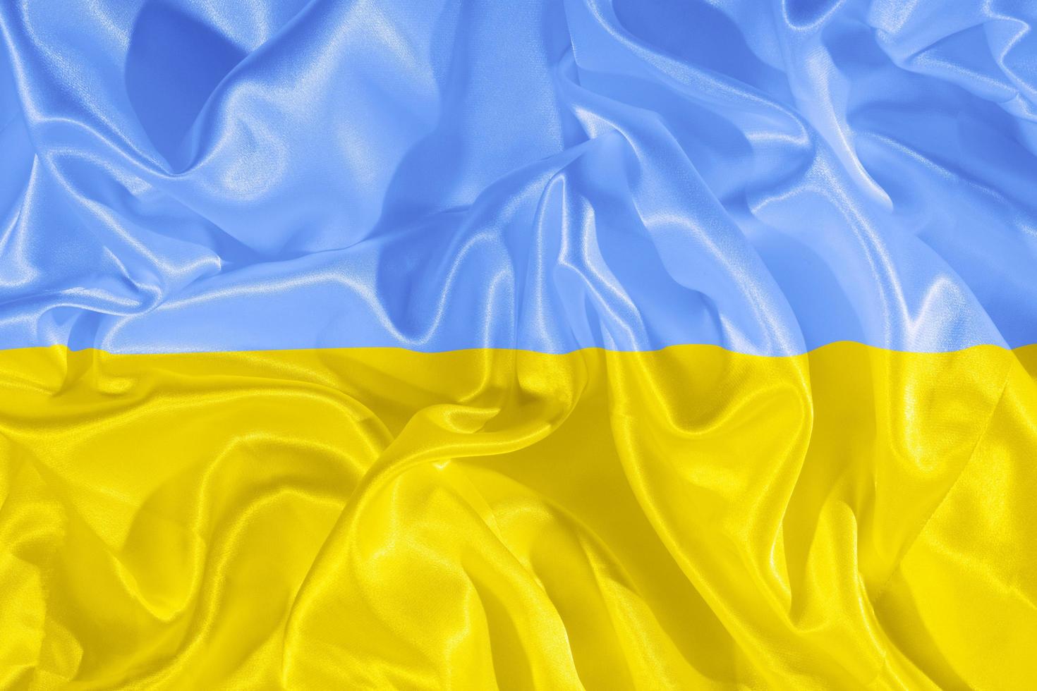 Yellow-blue cloth flag of Ukraine. National symbol of the state of Ukraine photo