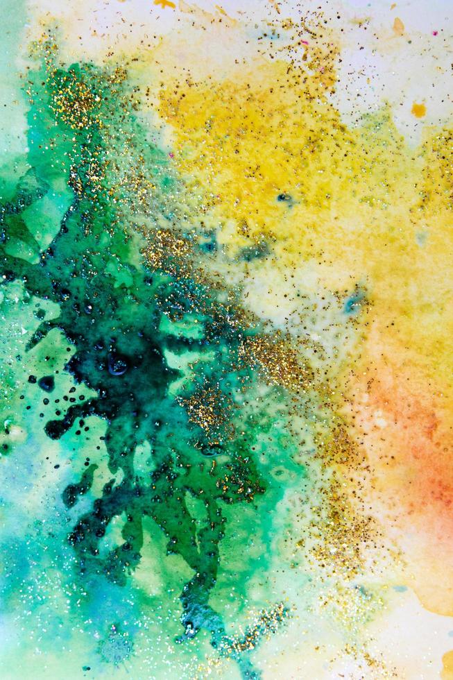 watercolor stains yellow-green with sparkles. Abstract background photo