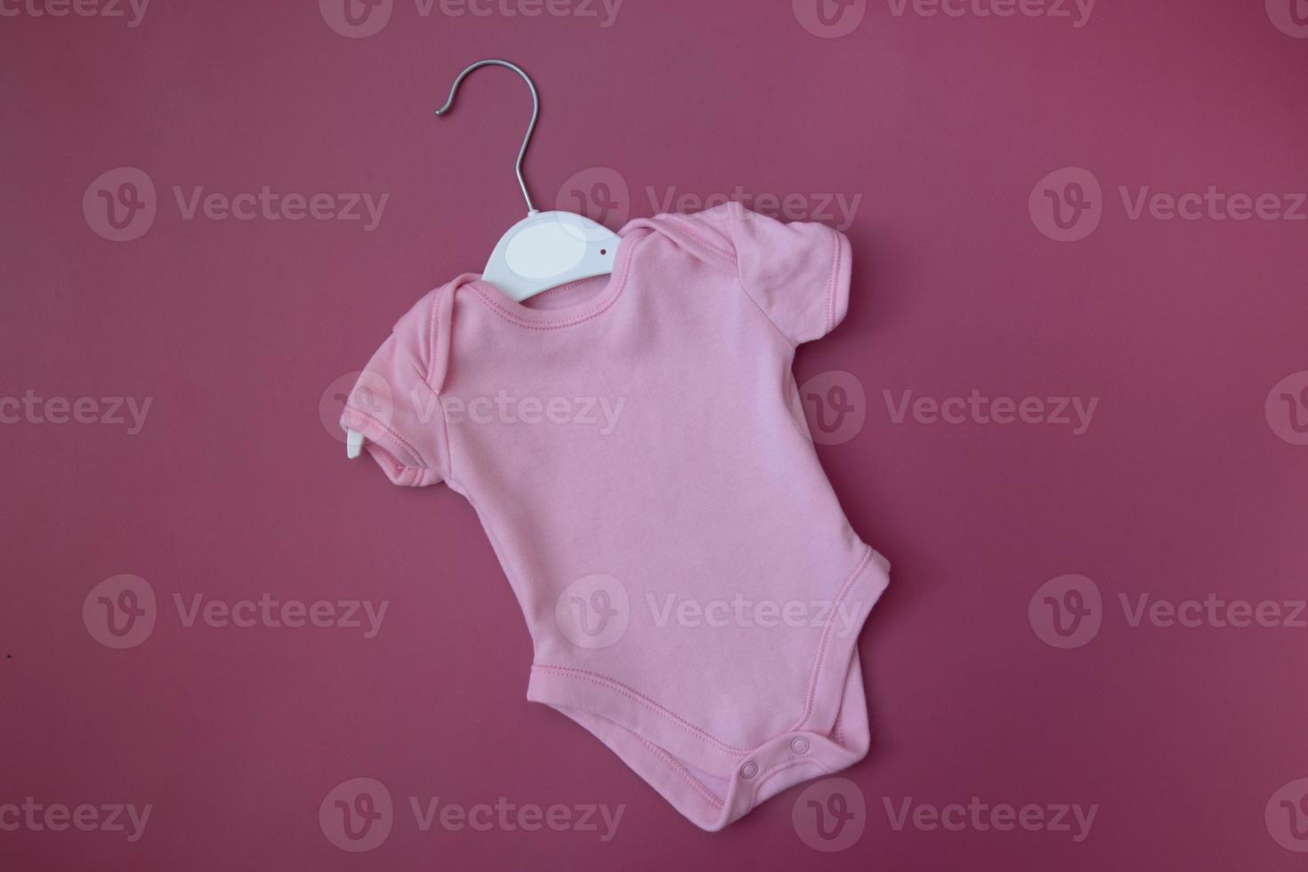 Pink baby clothes mock up for text, image, logo. Blank baby Bodysuit photo