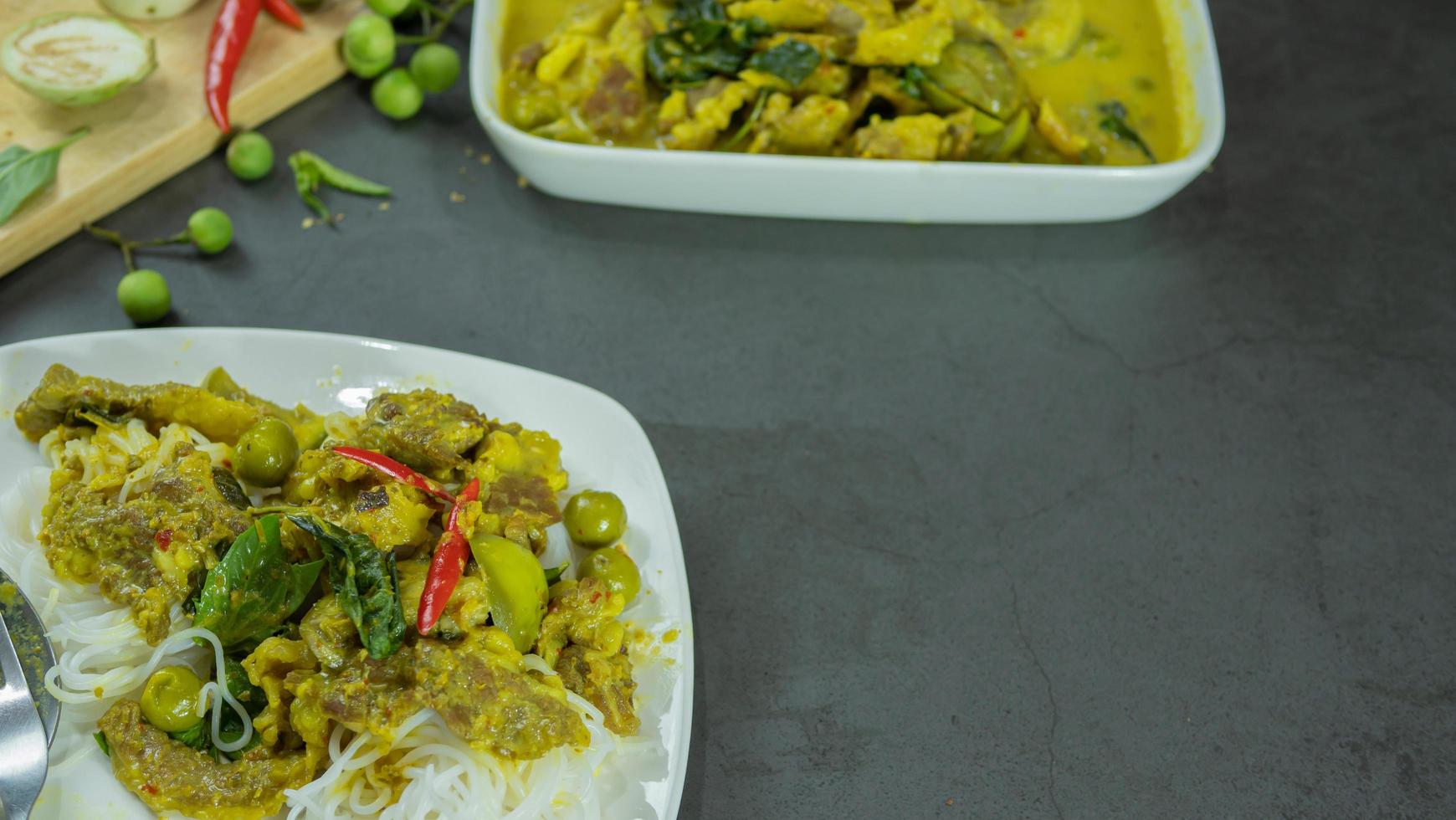 Green curry with beef. Famous food in Thailand. The food consists of curry paste. Blended with herbs Simmered with coconut milk And meat Season with fish sauce and sugar,add brinjal and sweet eggplant photo