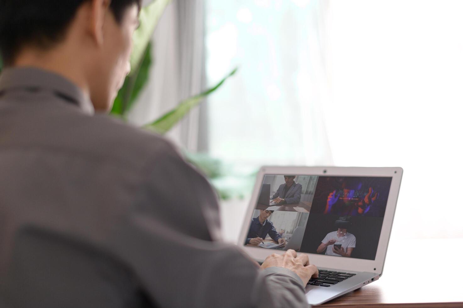 Businessman making call with colleagues online meeting, learning, teaching, online photo