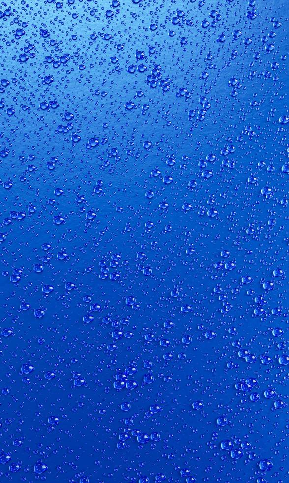 A lot of water droplets On metal or metalic surfaces in blue and dark blue shades for mobile background or wallpaper. 3D Rendering. photo