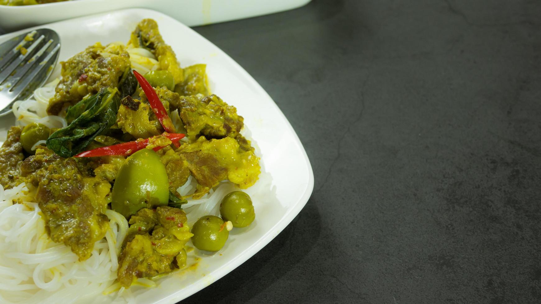 Green curry with beef. Famous food in Thailand. The food consists of curry paste. Blended with herbs Simmered with coconut milk And meat Season with fish sauce and sugar,add brinjal and sweet eggplant photo