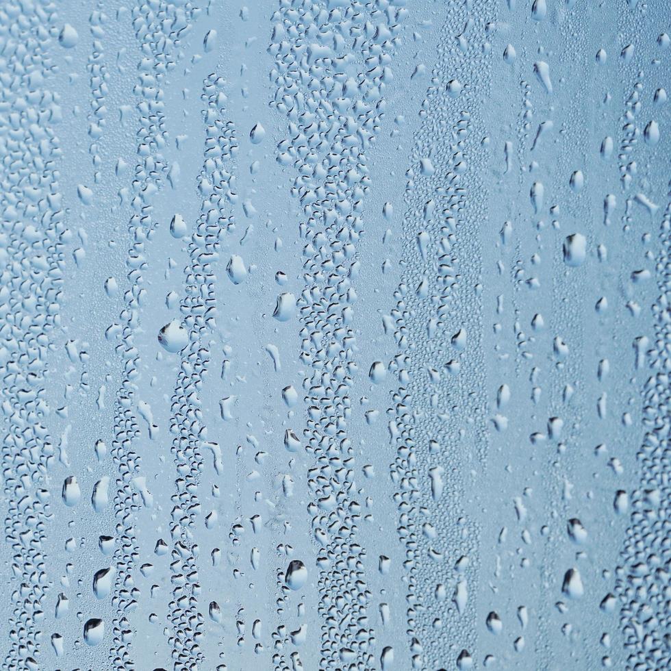 raindrops on the window in rainy days, abstract background photo