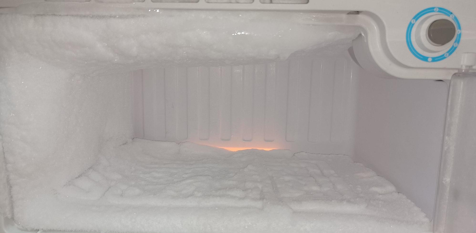 Thick ice build up on deep freezer lid photo