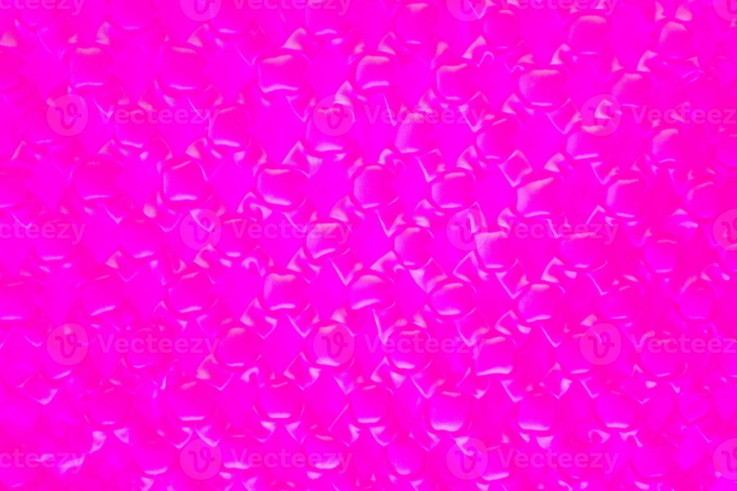 Purple pattern blurred background. Image close up out of focus from the cloths. Art design pattern. Glitter abstract with an elegant bright gradient design. photo