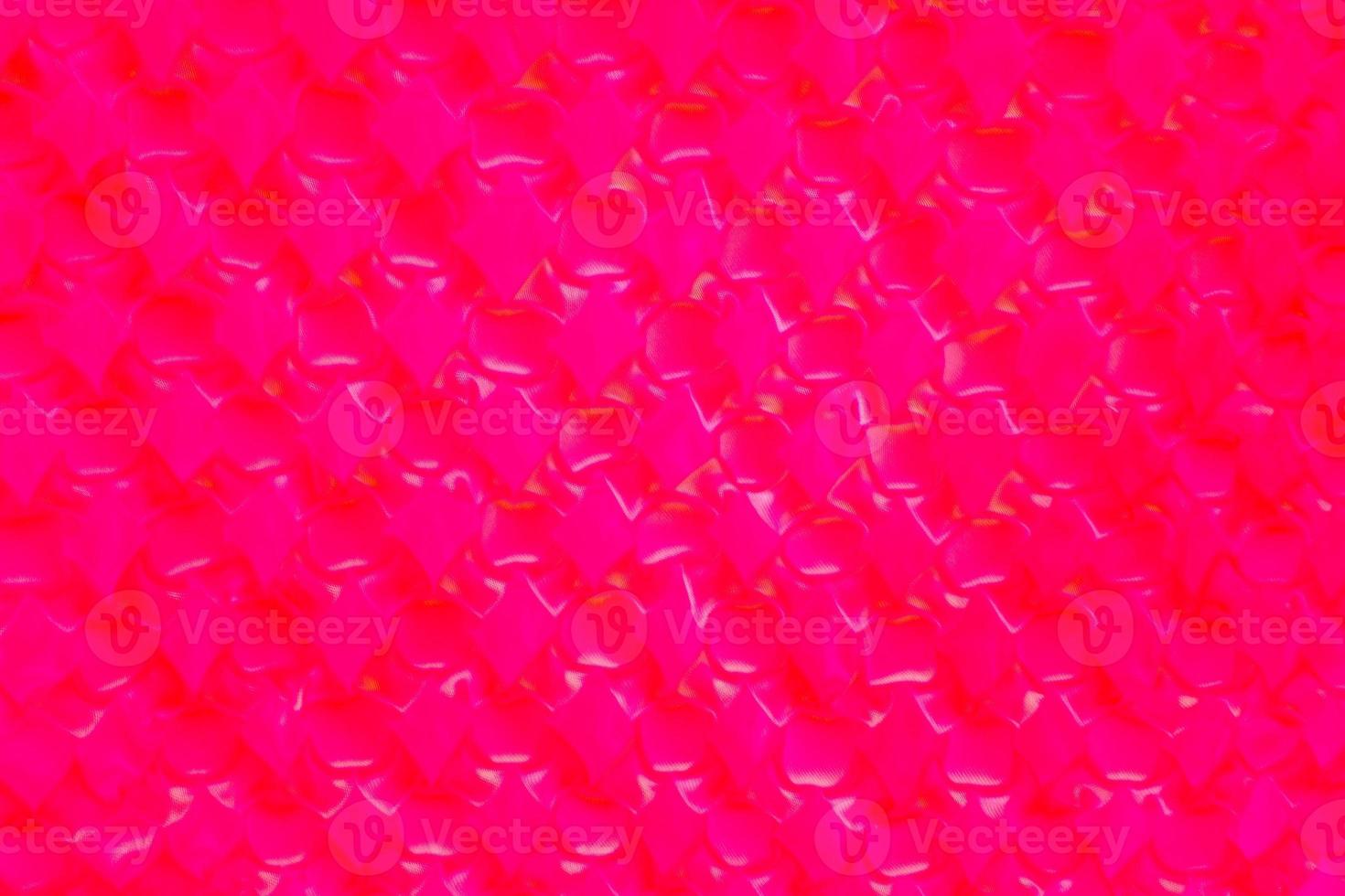 Purple pattern blurred background. Image close up out of focus from the cloths. Art design pattern. Glitter abstract with an elegant bright gradient design. photo