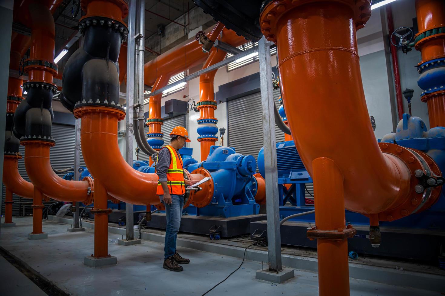 Industry engineer under checking the industry cooling tower air conditioner is water cooling tower air chiller HVAC of large industrial building to control air system. photo